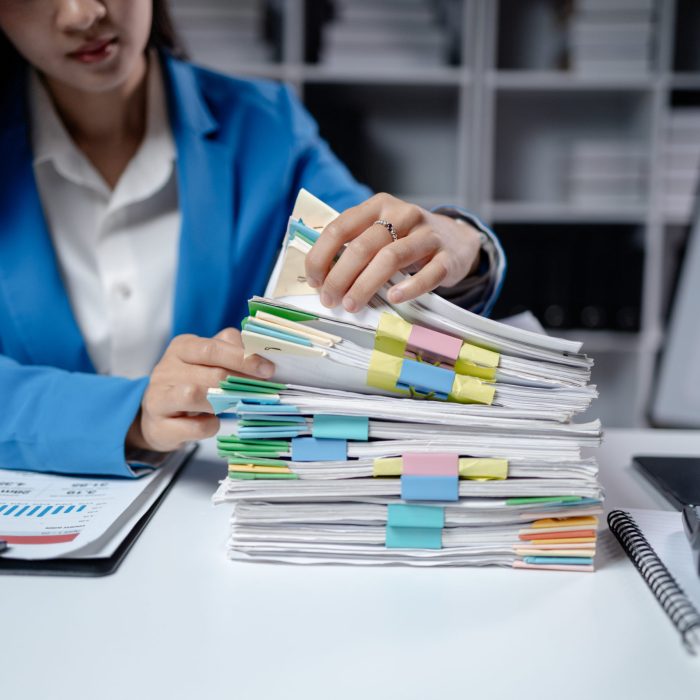 Business woman working in a startup company, female accountant working in auditing the company's accounts and finances, accounting and finance. Accounting and financial auditing concepts.